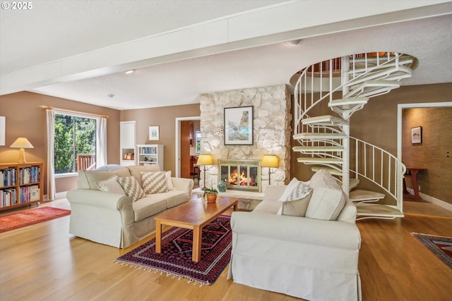 15 Cellini Ct, Lake Oswego, OR 97035 - living area with wood finished floors, baseboards, a stone fireplace, and stairs