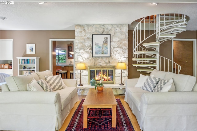 15 Cellini Ct, Lake Oswego, OR 97035 - living room featuring wood finished floors and a stone fireplace