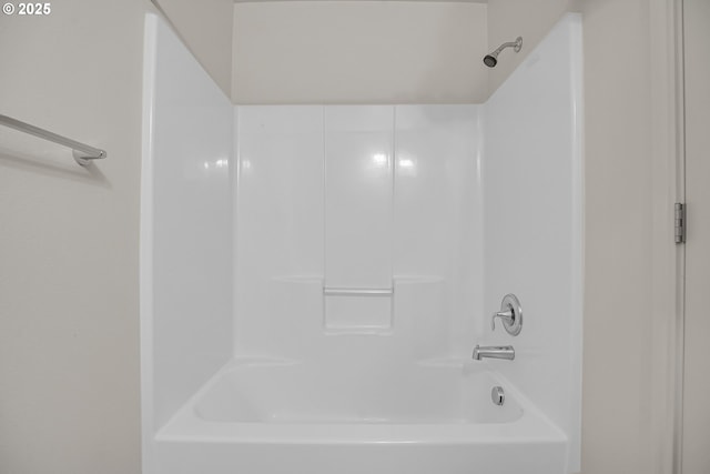 bathroom with shower / washtub combination