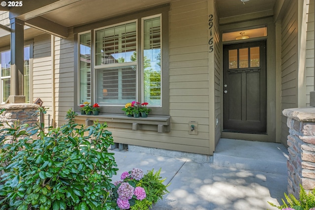 doorway to property with a porch