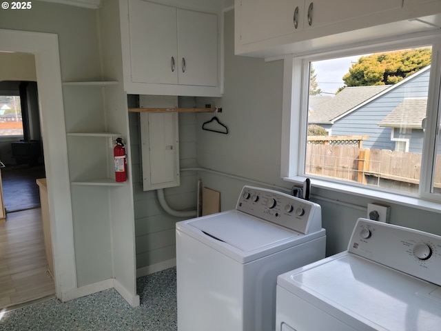 laundry area with a healthy amount of sunlight and washing machine and dryer