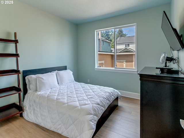 7913 SW Leiser Ln, Portland, OR 97224 - bedroom featuring wood finished floors and baseboards
