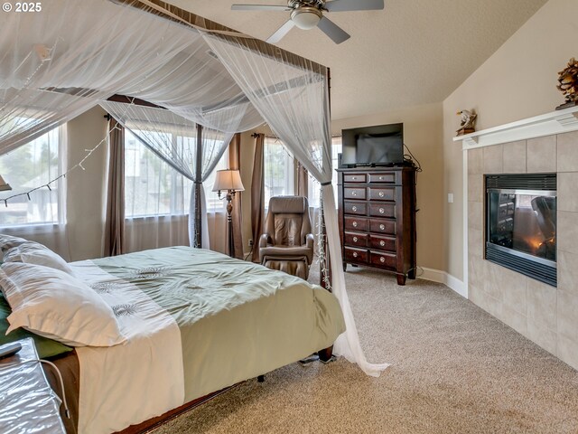 7913 SW Leiser Ln, Portland, OR 97224 - carpeted bedroom featuring a tile fireplace and a ceiling fan