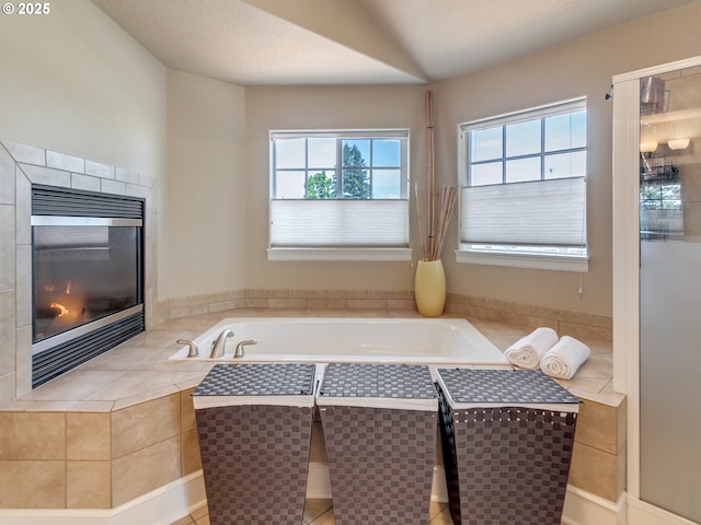 7913 SW Leiser Ln, Portland, OR 97224 - bathroom featuring a fireplace and a garden tub
