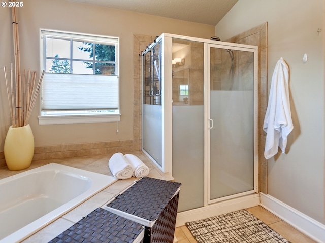 7913 SW Leiser Ln, Portland, OR 97224 - bathroom with a shower stall, a bath, healthy amount of natural light, and tile patterned floors