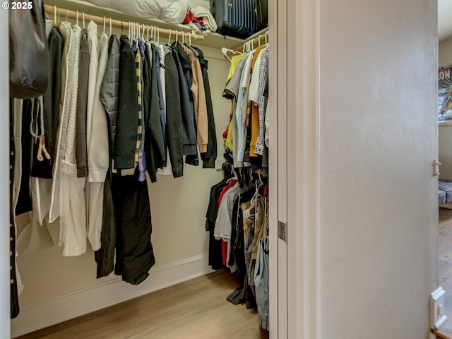 7913 SW Leiser Ln, Portland, OR 97224 - walk in closet with wood finished floors