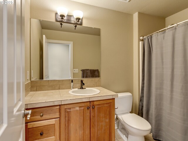 7913 SW Leiser Ln, Portland, OR 97224 - full bathroom with vanity, tile patterned floors, and curtained shower