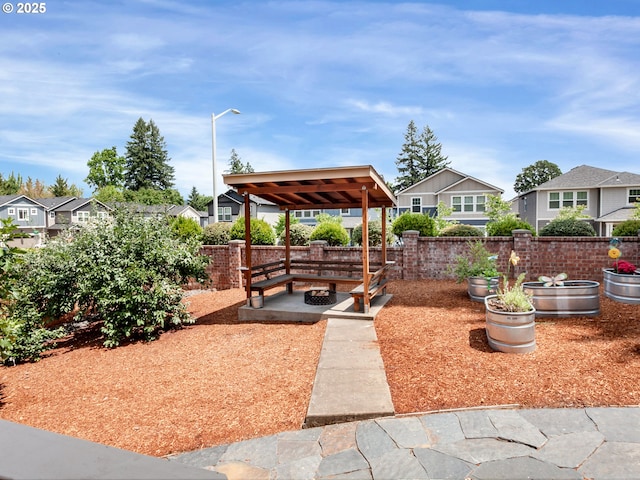 7913 SW Leiser Ln, Portland, OR 97224 - fenced backyard with an outdoor fire pit, a residential view, and a gazebo