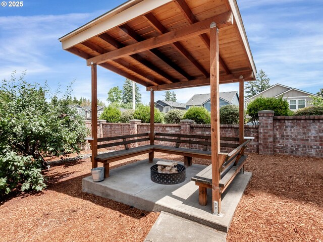 7913 SW Leiser Ln, Portland, OR 97224 - view of patio with a fire pit