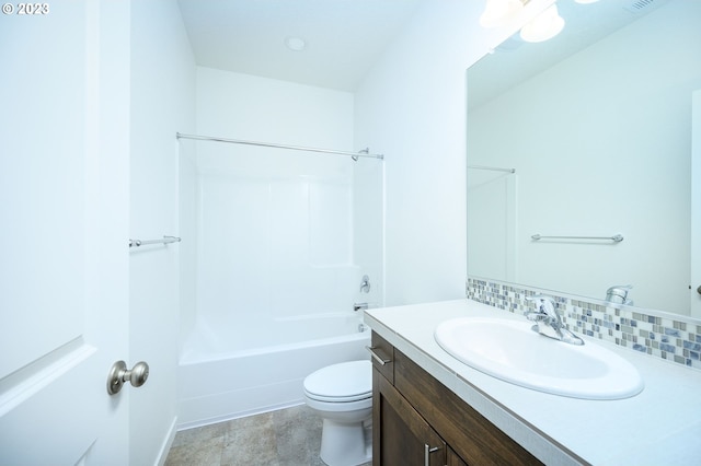 full bathroom featuring shower / bathing tub combination, toilet, vanity, and tasteful backsplash