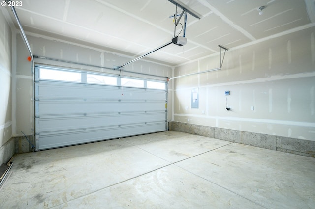 garage with electric panel and a garage door opener