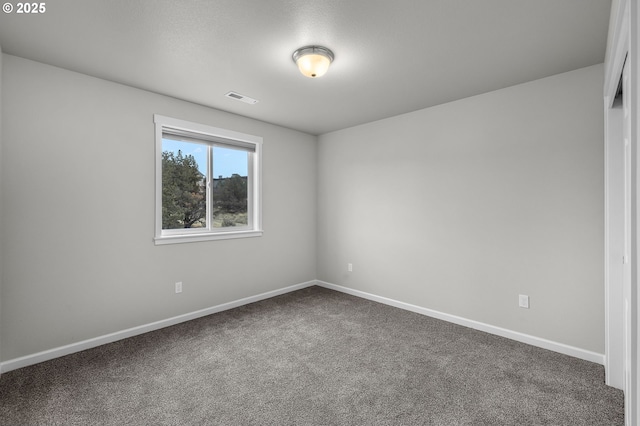 spare room featuring carpet flooring