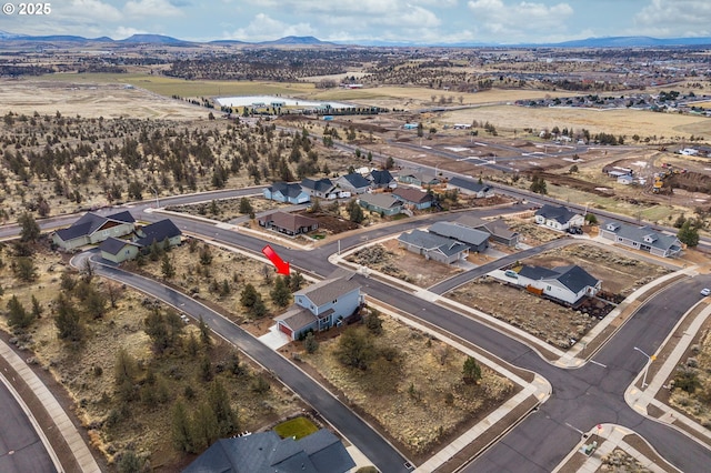 birds eye view of property featuring a mountain view