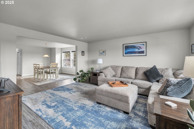 living room with dark wood-type flooring