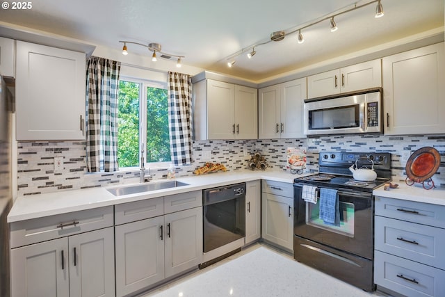 1819 SE 173rd Ave, Vancouver, WA 98683 - kitchen featuring stainless steel microwave, black electric range, dishwashing machine, gray cabinets, and light countertops