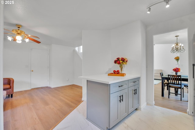 1819 SE 173rd Ave, Vancouver, WA 98683 - kitchen featuring gray cabinets, light countertops, a ceiling fan, a chandelier, and open floor plan