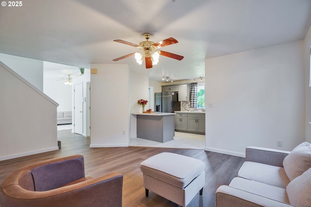 1819 SE 173rd Ave, Vancouver, WA 98683 - living room with ceiling fan, light wood-style floors, and baseboards