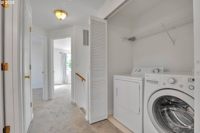 1819 SE 173rd Ave, Vancouver, WA 98683 - laundry room featuring separate washer and dryer, light carpet, and baseboards