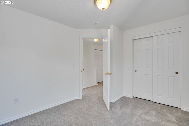 1819 SE 173rd Ave, Vancouver, WA 98683 - unfurnished bedroom featuring carpet, baseboards, a closet, and a textured ceiling