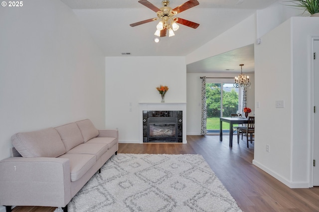 1819 SE 173rd Ave, Vancouver, WA 98683 - living area with vaulted ceiling, a chandelier, wood finished floors, a tile fireplace, and a ceiling fan