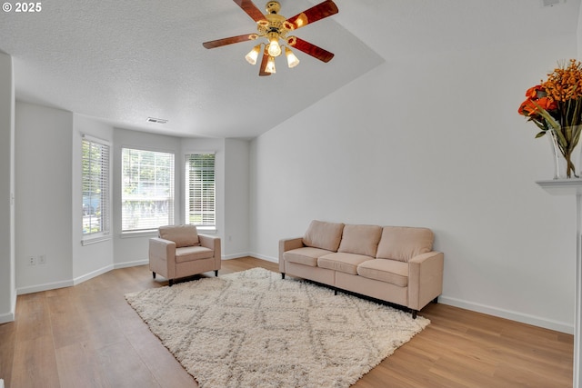 1819 SE 173rd Ave, Vancouver, WA 98683 - living area featuring light wood finished floors, a ceiling fan, and baseboards