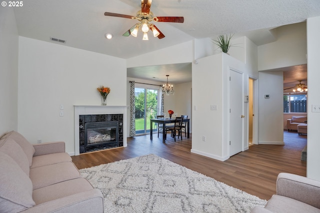 1819 SE 173rd Ave, Vancouver, WA 98683 - living area with ceiling fan, a chandelier, wood finished floors, baseboards, and a tile fireplace