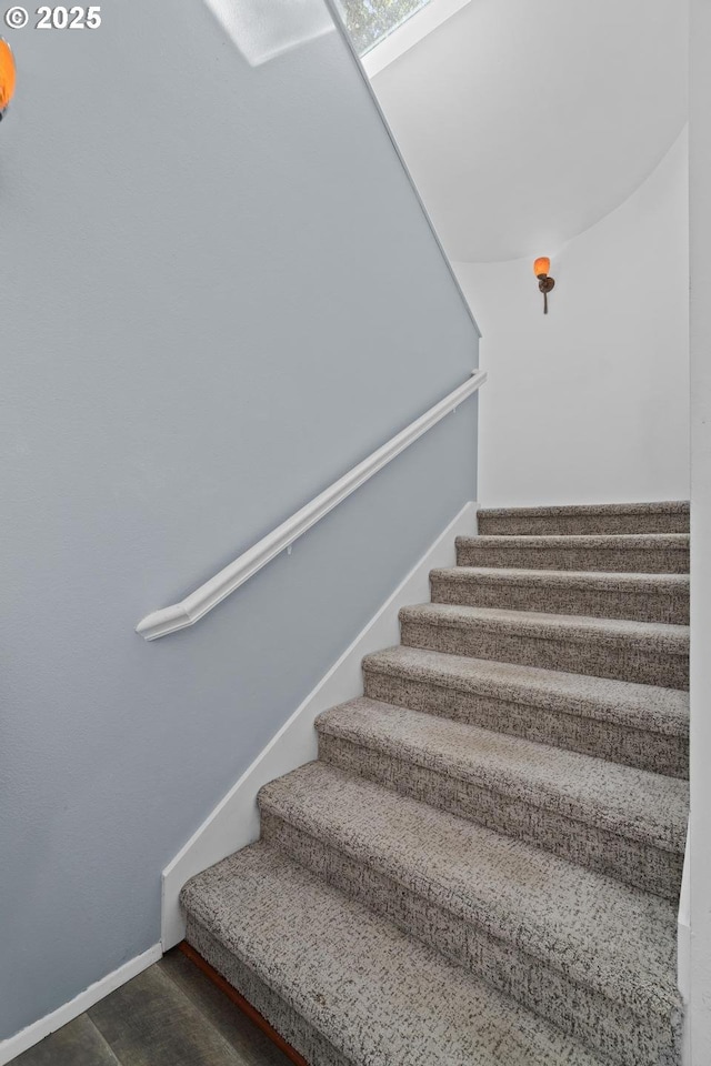 stairs featuring baseboards
