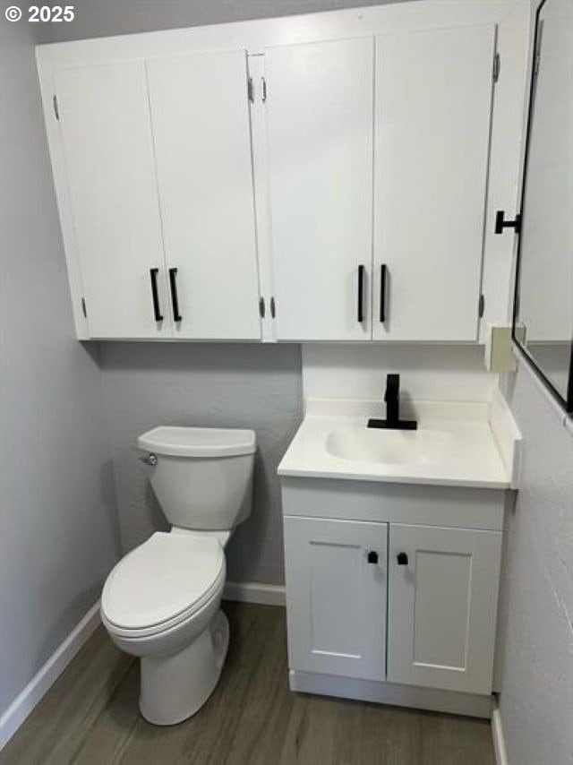 1127 6th Ave, Albany, OR 97321 - bathroom featuring wood finished floors and vanity