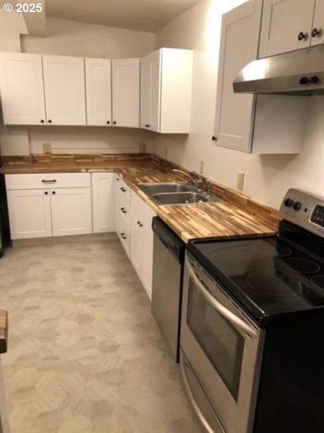 1127 6th Ave, Albany, OR 97321 - kitchen with stainless steel appliances, butcher block countertops, under cabinet range hood, and white cabinets
