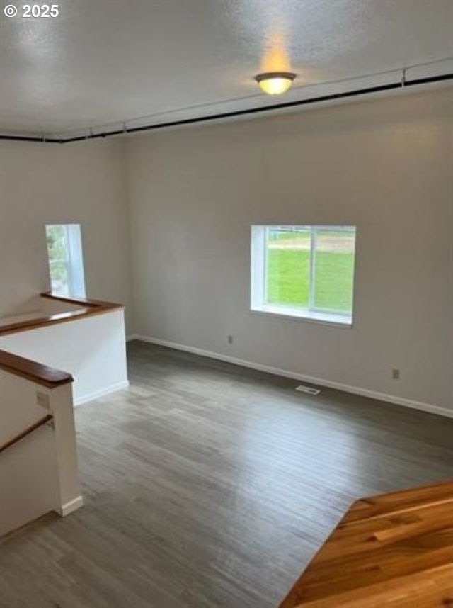 1127 6th Ave, Albany, OR 97321 - empty room with plenty of natural light and wood finished floors