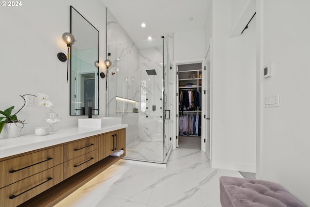 750 NE Province Ct, Camas, WA 98607 - bathroom featuring a marble finish shower, vanity, marble finish flooring, a walk in closet, and recessed lighting