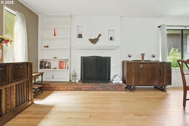 19985 SW Carlin Blvd, Beaverton, OR 97078 - living room with wood finished floors, a brick fireplace, and built in features