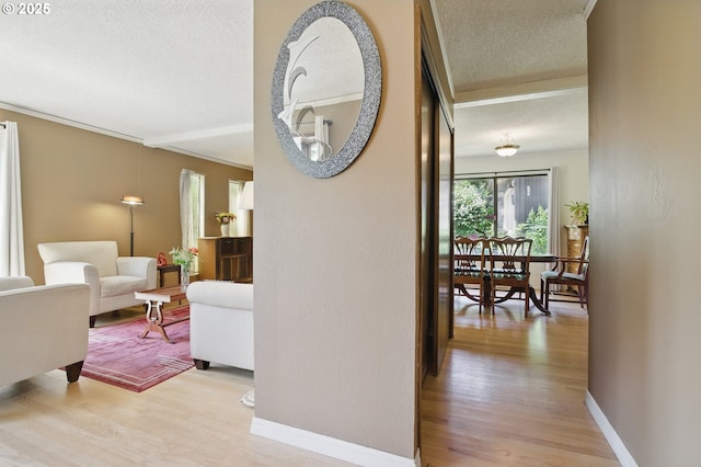 19985 SW Carlin Blvd, Beaverton, OR 97078 - hall with a textured ceiling, light wood-style flooring, and crown molding