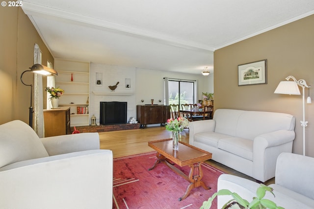 19985 SW Carlin Blvd, Beaverton, OR 97078 - living room with wood finished floors, a fireplace, and ornamental molding