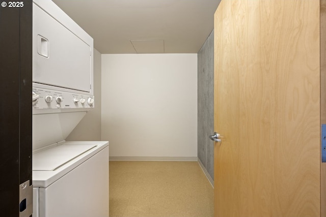 laundry room with stacked washing maching and dryer