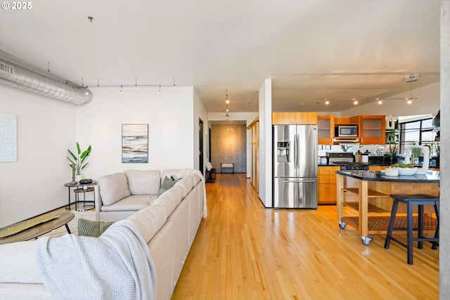 333 NW 9th Ave Unit 1323, Portland, OR 97209 - living area featuring track lighting and light wood-style floors