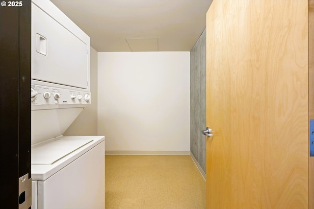 333 NW 9th Ave Unit 1323, Portland, OR 97209 - laundry area with stacked washer / dryer, attic access, and baseboards