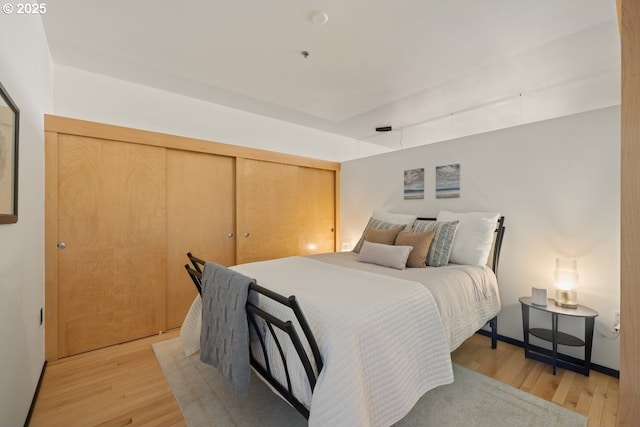 bedroom with light hardwood / wood-style flooring