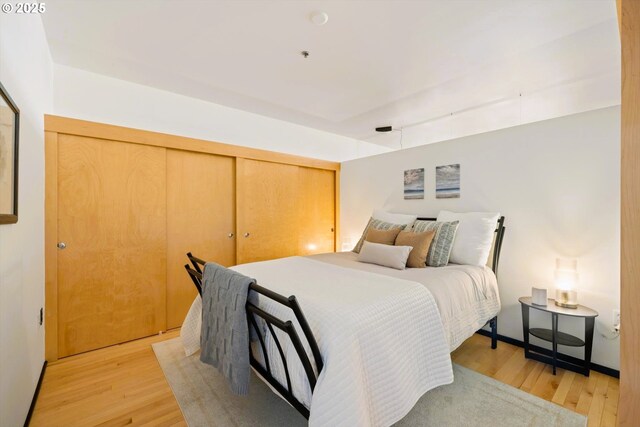 333 NW 9th Ave Unit 1323, Portland, OR 97209 - living room featuring track lighting, light wood finished floors, and plenty of natural light