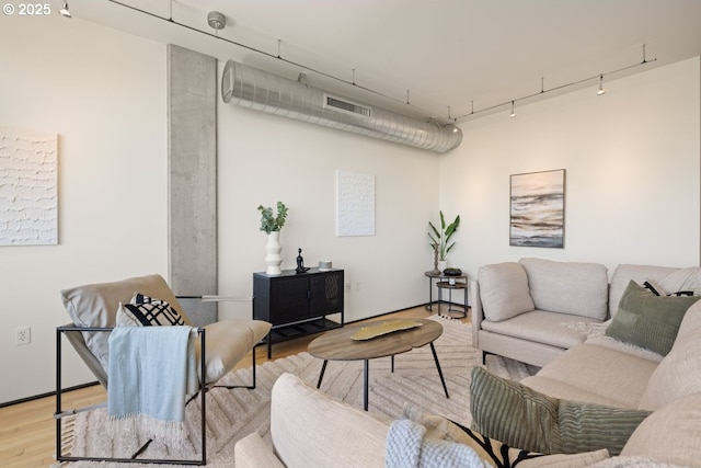 living room featuring track lighting and light wood-type flooring