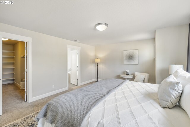 21338 SW Simon Ter, Sherwood, OR 97140 - carpeted bedroom featuring a spacious closet and connected bathroom