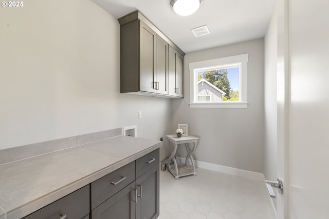21338 SW Simon Ter, Sherwood, OR 97140 - washroom featuring cabinet space, hookup for a washing machine, light tile patterned floors, and electric dryer hookup