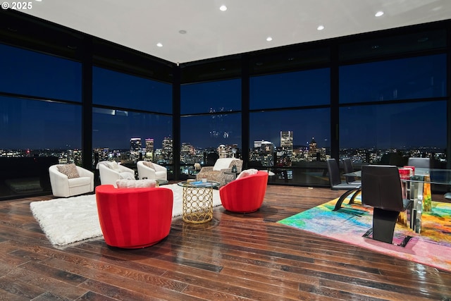 1551 SW Upper Hall St, Portland, OR 97201 - living room featuring a wall of windows, hardwood / wood-style flooring, a view of city lights, a towering ceiling, and recessed lighting