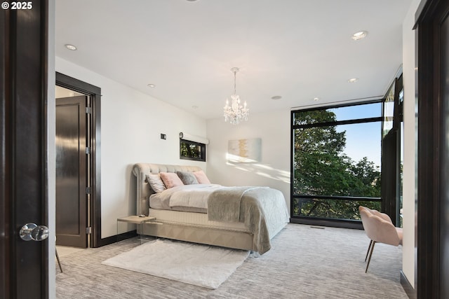 1551 SW Upper Hall St, Portland, OR 97201 - bedroom featuring floor to ceiling windows, a chandelier, recessed lighting, and light colored carpet