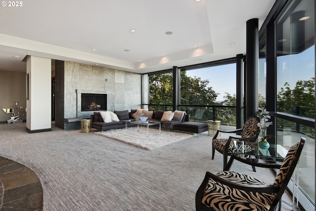 1551 SW Upper Hall St, Portland, OR 97201 - carpeted living room featuring a wall of windows, a large fireplace, recessed lighting, and a raised ceiling