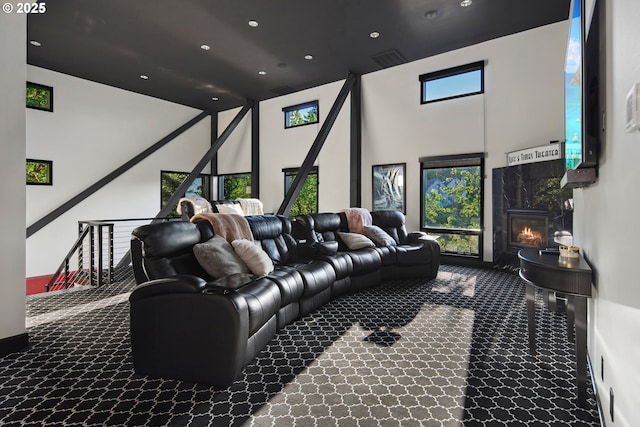 1551 SW Upper Hall St, Portland, OR 97201 - home theater featuring carpet flooring, a high ceiling, a premium fireplace, and recessed lighting
