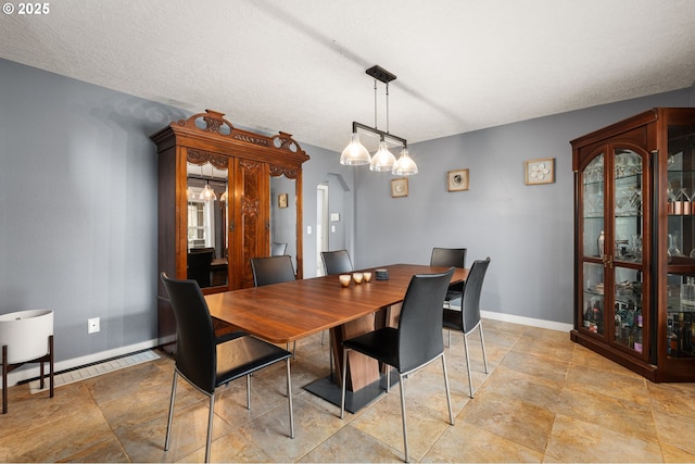 7820 SE 114th Ave, Portland, OR 97266 - dining room with arched walkways, baseboards, and baseboard heating