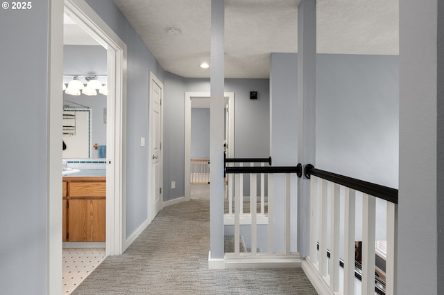 7820 SE 114th Ave, Portland, OR 97266 - hall with an upstairs landing, light carpet, baseboards, a textured ceiling, and radiator heating unit