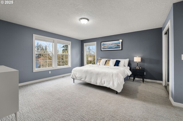 7820 SE 114th Ave, Portland, OR 97266 - bedroom featuring carpet flooring, baseboards, and a textured ceiling