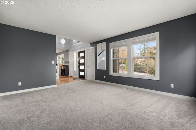 7820 SE 114th Ave, Portland, OR 97266 - carpeted spare room featuring baseboards and a textured ceiling